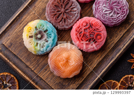 Chinese mooncake is an Asian sweet dessert. Asian mooncake as a background for your design Chinese mooncake is an Asian sweet dessert. Asian mooncake as a background for your design 129993397