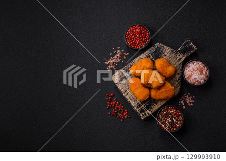 Chicken nuggets in breading, takeaway food, junk food Chicken nuggets in breading, takeaway food, junk food 129993910