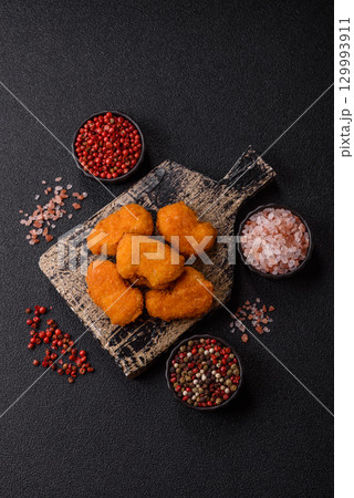 Chicken nuggets in breading, takeaway food, junk food 129993911