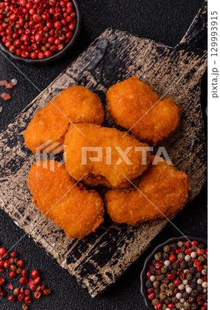 Chicken nuggets in breading, takeaway food, junk food Chicken nuggets in breading, takeaway food, junk food 129993915