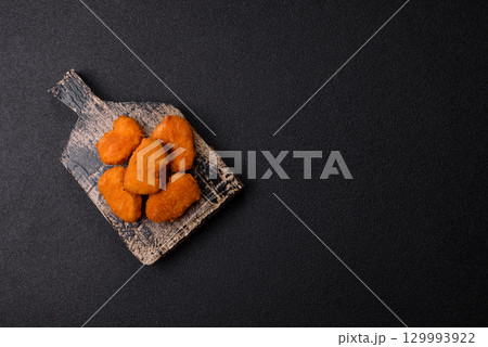 Chicken nuggets in breading, takeaway food, junk food Chicken nuggets in breading, takeaway food, junk food 129993922
