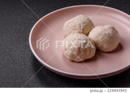 Chicken meatballs, cutlets steamed with salt and spices, a healthy meal 129993943
