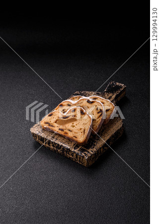 Christmas Stollen, a German sweet cake with marzipan and fruit. Winter Christmas Stollen 129994130