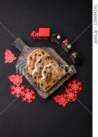 Christmas Stollen, a German sweet cake with marzipan and fruit. Winter Christmas Stollen 129994141