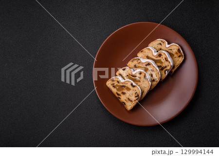 Christmas Stollen, a German sweet cake with marzipan and fruit. Winter Christmas Stollen 129994144