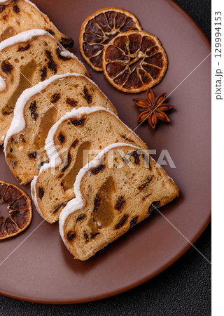 Christmas Stollen, a German sweet cake with marzipan and fruit. Winter Christmas Stollen 129994153