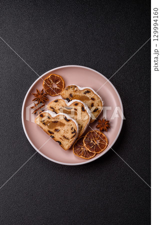 Christmas Stollen, a German sweet cake with marzipan and fruit. Winter Christmas Stollen 129994160