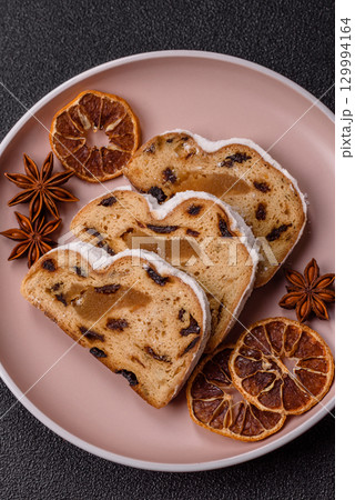 Christmas Stollen, a German sweet cake with marzipan and fruit. Winter Christmas Stollen 129994164