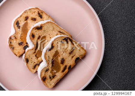 Christmas Stollen, a German sweet cake with marzipan and fruit. Winter Christmas Stollen 129994167