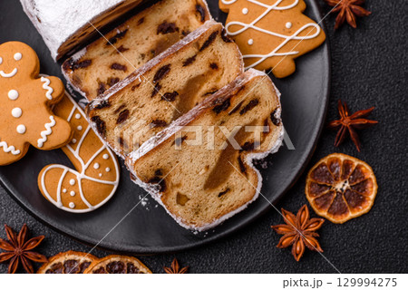 Christmas Stollen, a German sweet cake with marzipan and fruit. Winter Christmas Stollen 129994275