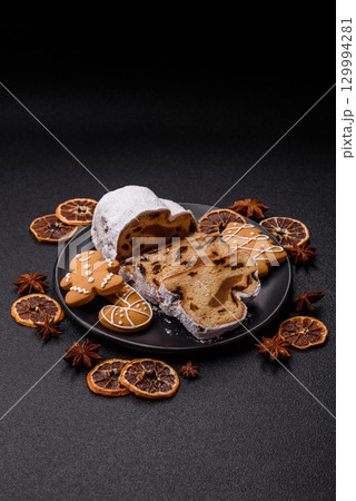 Christmas Stollen, a German sweet cake with marzipan and fruit. Winter Christmas Stollen 129994281