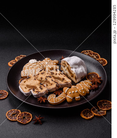 Christmas Stollen, a German sweet cake with marzipan and fruit. Winter Christmas Stollen 129994285