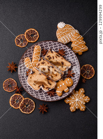 Christmas Stollen, a German sweet cake with marzipan and fruit. Winter Christmas Stollen 129994299