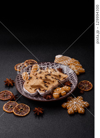 Christmas Stollen, a German sweet cake with marzipan and fruit. Winter Christmas Stollen 129994300