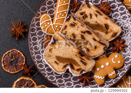 Christmas Stollen, a German sweet cake with marzipan and fruit. Winter Christmas Stollen 129994302