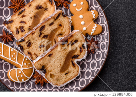 Christmas Stollen, a German sweet cake with marzipan and fruit. Winter Christmas Stollen 129994306