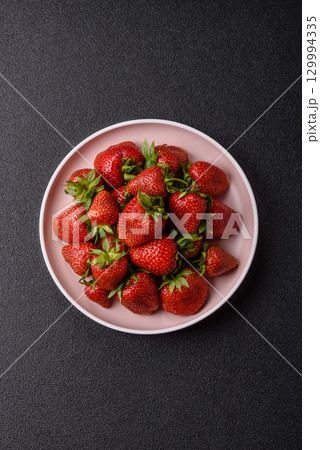 Strawberry, fresh juicy berries and fruits as background 129994335