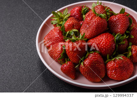 Strawberry, fresh juicy berries and fruits as background Strawberry, fresh juicy berries and fruits as background 129994337