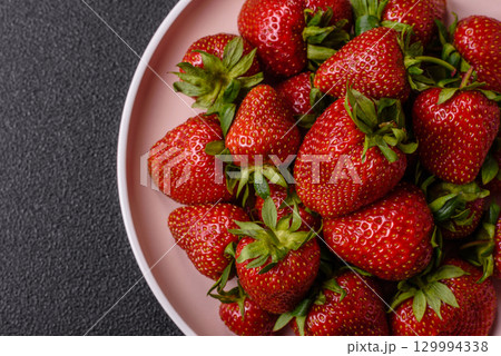 Strawberry, fresh juicy berries and fruits as background 129994338