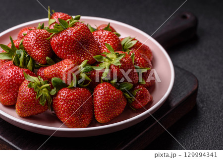 Strawberry, fresh juicy berries and fruits as background 129994341