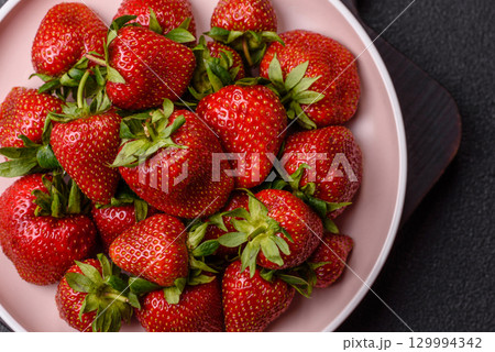 Strawberry, fresh juicy berries and fruits as background 129994342