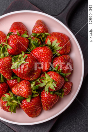 Strawberry, fresh juicy berries and fruits as background 129994343