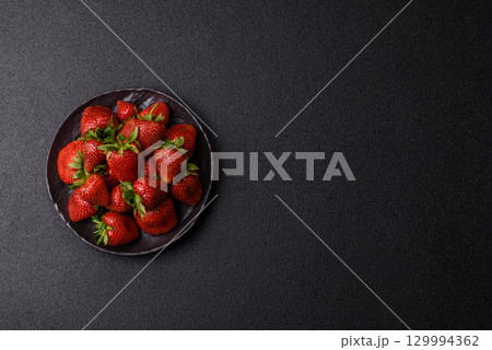 Strawberry, fresh juicy berries and fruits as background Strawberry, fresh juicy berries and fruits as background 129994362