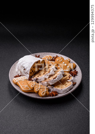 Christmas Stollen, a German sweet cake with marzipan and fruit. Winter Christmas Stollen 129994375