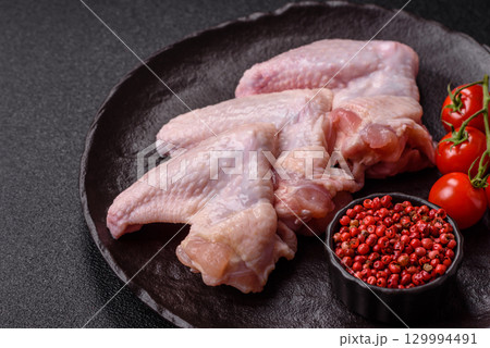 Raw chicken wings, fresh uncooked poultry meat. Chicken or turkey wings 129994491