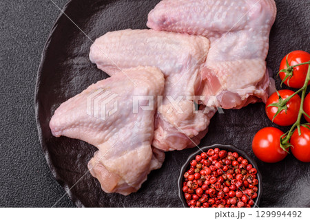 Raw chicken wings, fresh uncooked poultry meat. Chicken or turkey wings 129994492