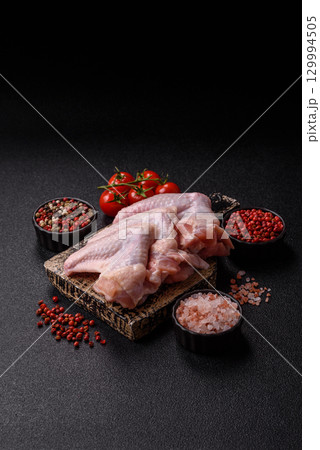 Raw chicken wings, fresh uncooked poultry meat. Chicken or turkey wings 129994505