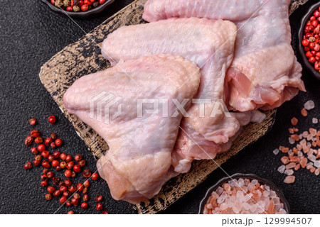 Raw chicken wings, fresh uncooked poultry meat. Chicken or turkey wings 129994507