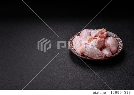 Raw chicken wings, fresh uncooked poultry meat. Chicken or turkey wings 129994518