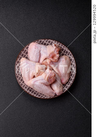 Raw chicken wings, fresh uncooked poultry meat. Chicken or turkey wings 129994520