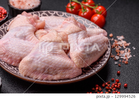 Raw chicken wings, fresh uncooked poultry meat. Chicken or turkey wings 129994526