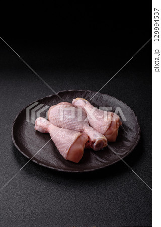 Raw chicken legs, fresh uncooked poultry meat. Chicken or turkey legs Raw chicken legs, fresh uncooked poultry meat. Chicken or turkey legs 129994537