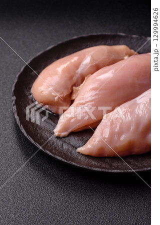 Meat, raw chicken fillets, poultry breast, skinless and boneless food. Raw chicken fillet 129994626