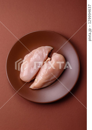 Meat, raw chicken fillets, poultry breast, skinless and boneless food. Raw chicken fillet 129994637