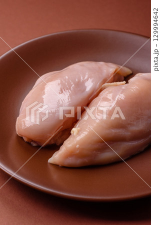 Meat, raw chicken fillets, poultry breast, skinless and boneless food. Raw chicken fillet 129994642
