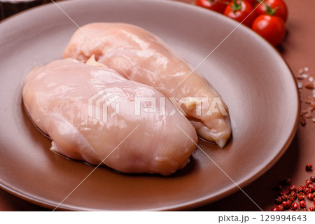 Meat, raw chicken fillets, poultry breast, skinless and boneless food. Raw chicken fillet 129994643