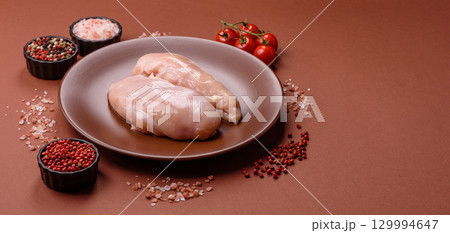 Meat, raw chicken fillets, poultry breast, skinless and boneless food. Raw chicken fillet Meat, raw chicken fillets, poultry breast, skinless and boneless food. Raw chicken fillet 129994647