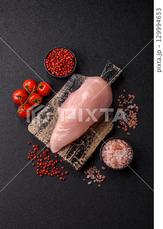 Meat, raw chicken fillets, poultry breast, skinless and boneless food. Raw chicken fillet 129994653