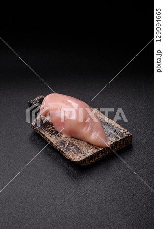 Meat, raw chicken fillets, poultry breast, skinless and boneless food. Raw chicken fillet 129994665