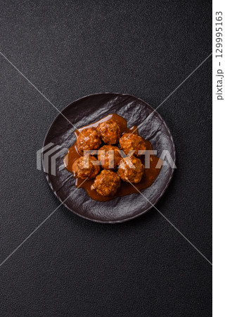Meat, meatballs in tomato sauce, Italian food, beef or pork with salt . Meatballs with tomatoes Meat, meatballs in tomato sauce, Italian food, beef or pork with salt . Meatballs with tomatoes 129995163