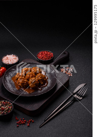 Meat, meatballs in tomato sauce, Italian food, beef or pork with salt . Meatballs with tomatoes Meat, meatballs in tomato sauce, Italian food, beef or pork with salt . Meatballs with tomatoes 129995175