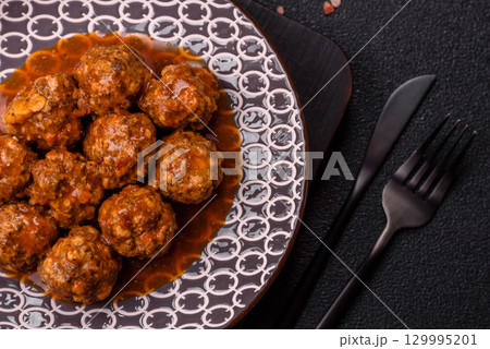 Meat, meatballs in tomato sauce, Italian food, beef or pork with salt . Meatballs with tomatoes Meat, meatballs in tomato sauce, Italian food, beef or pork with salt . Meatballs with tomatoes 129995201