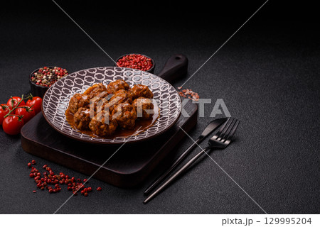 Meat, meatballs in tomato sauce, Italian food, beef or pork with salt . Meatballs with tomatoes 129995204