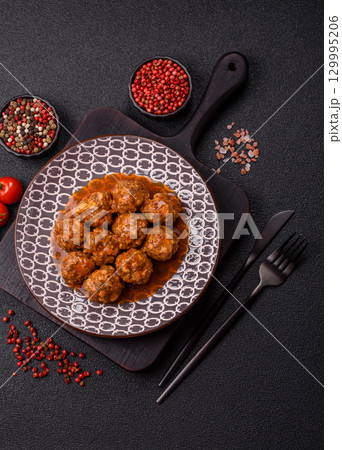 Meat, meatballs in tomato sauce, Italian food, beef or pork with salt . Meatballs with tomatoes Meat, meatballs in tomato sauce, Italian food, beef or pork with salt . Meatballs with tomatoes 129995206