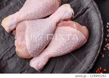 Raw chicken legs, fresh uncooked poultry meat. Chicken or turkey legs Raw chicken legs, fresh uncooked poultry meat. Chicken or turkey legs 129995262