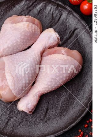 Raw chicken legs, fresh uncooked poultry meat. Chicken or turkey legs 129995263